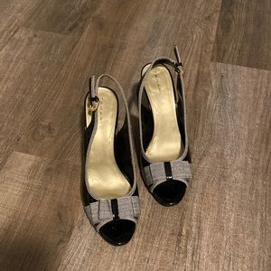 Tahari black and white high heeled sandals.